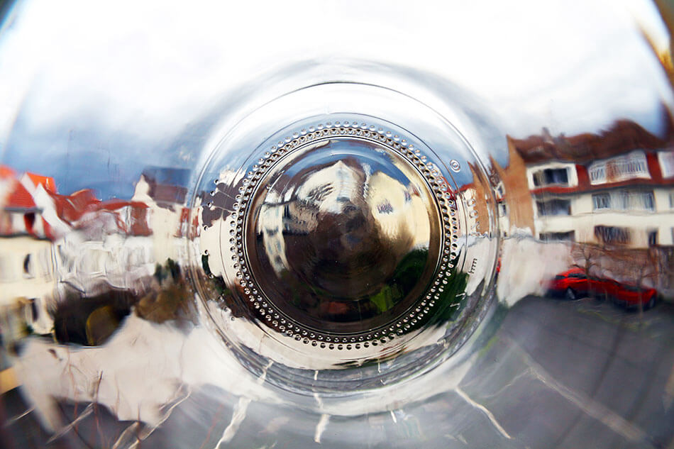 apartments through the bottom of a glass jar