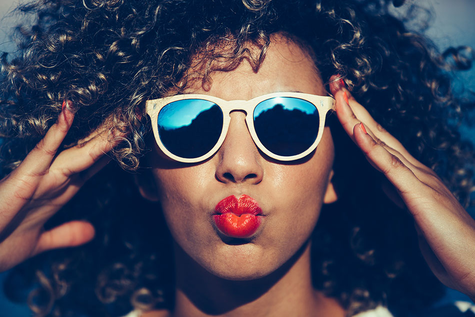 beautiful woman wearing mirrored sunglasses