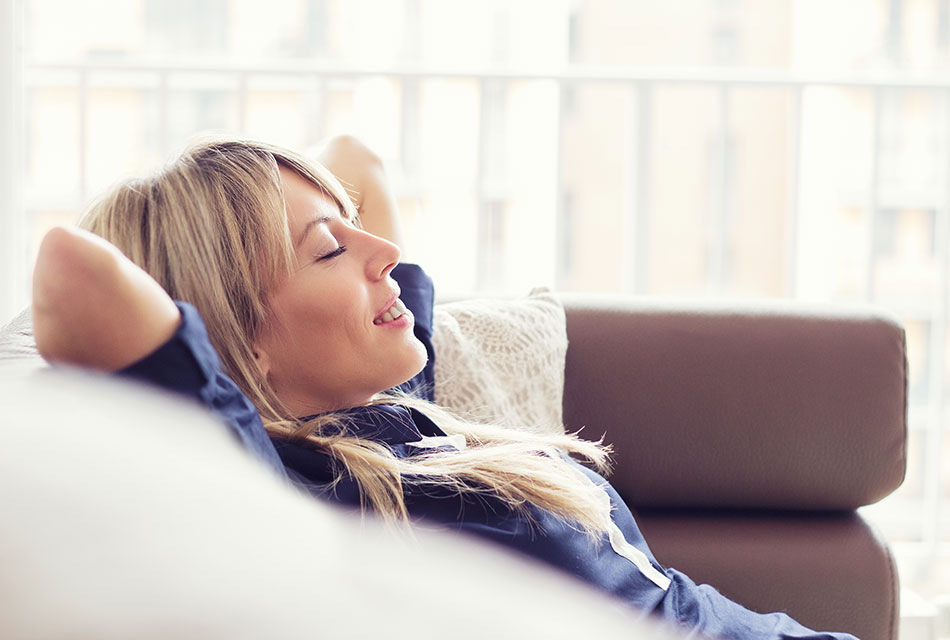 blonde woman relaxed on couch