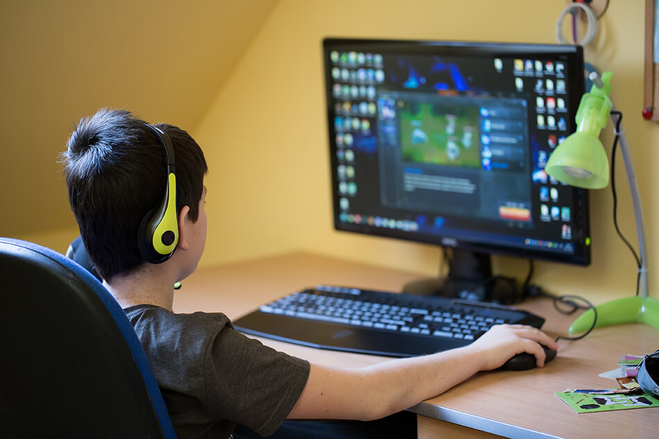 boy playing games on the computer