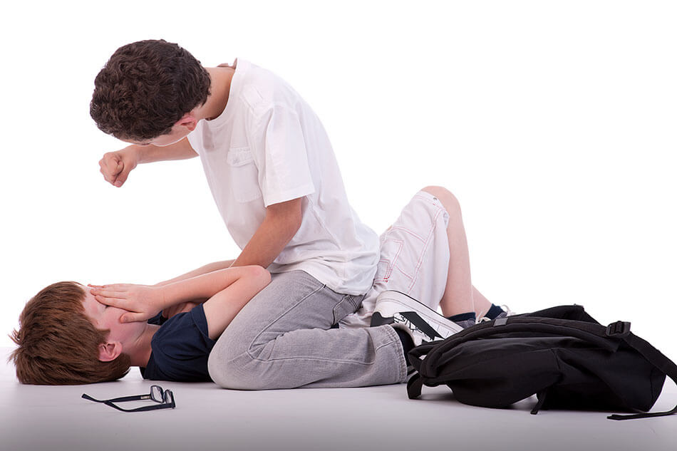 child with glasses being bullied