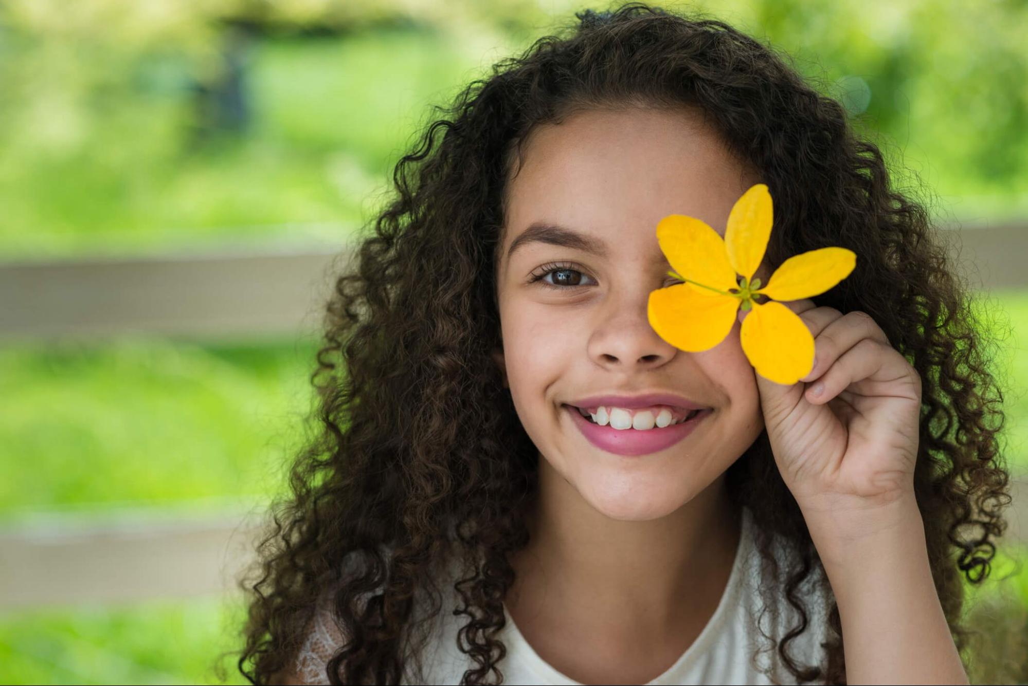 Child outdoors showing healthy vision during myopia management