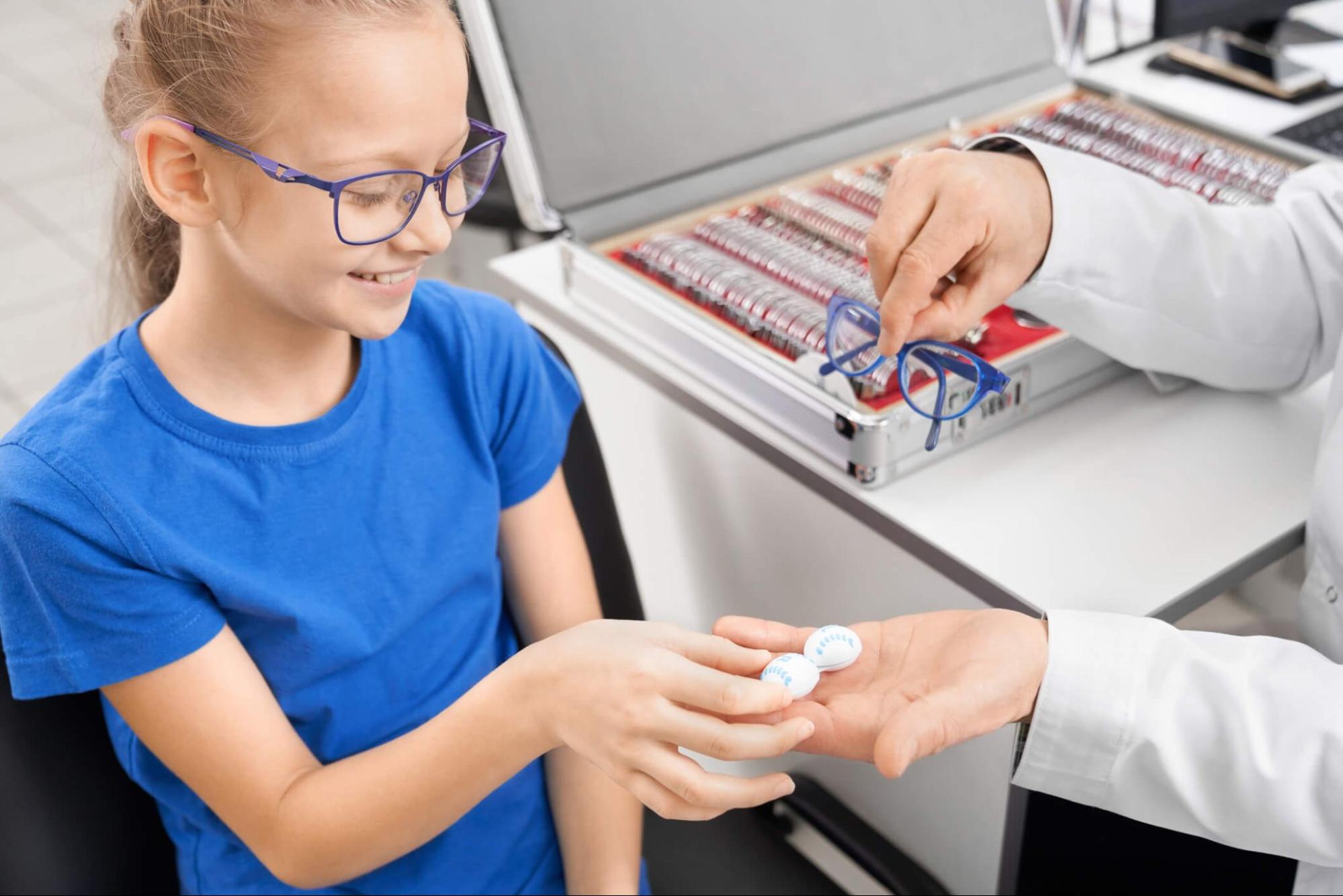 Child receiving contact lenses for myopia management