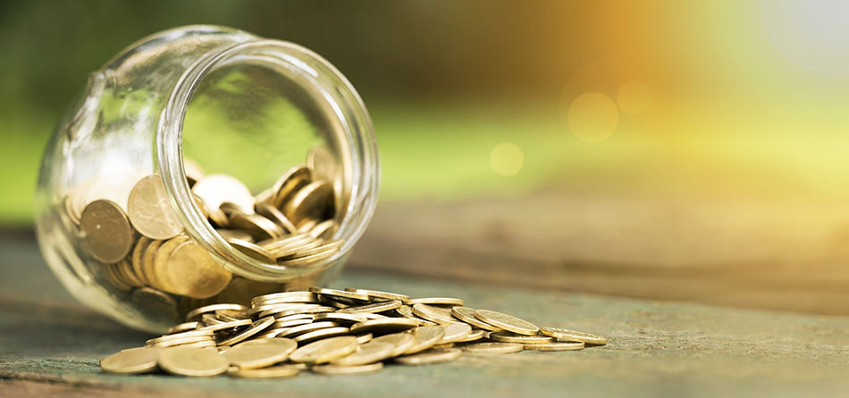 money falling out of a clear jar