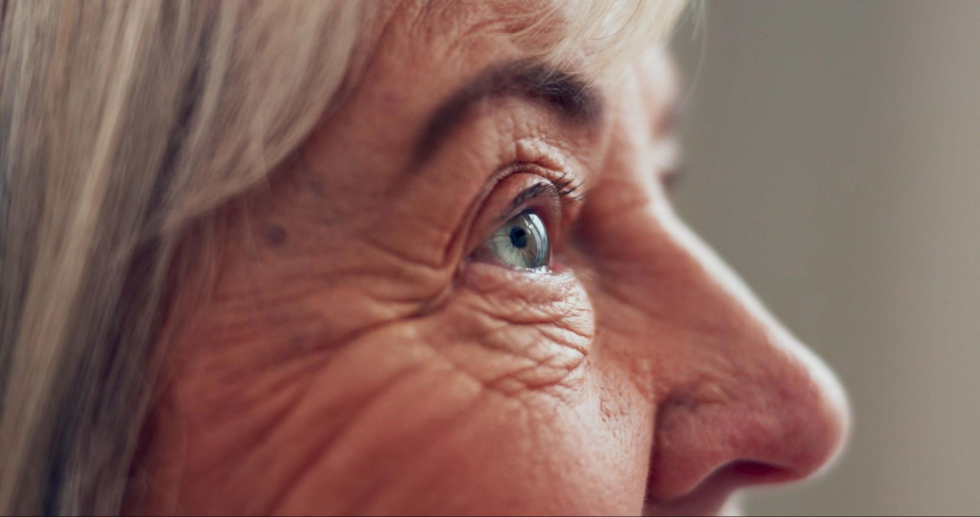 Close-up of an aging eye focusing clearly with the help of progressive contact lenses