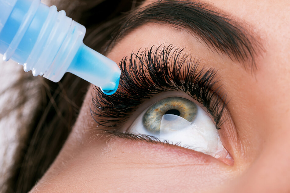 closeup of eye and eye drops