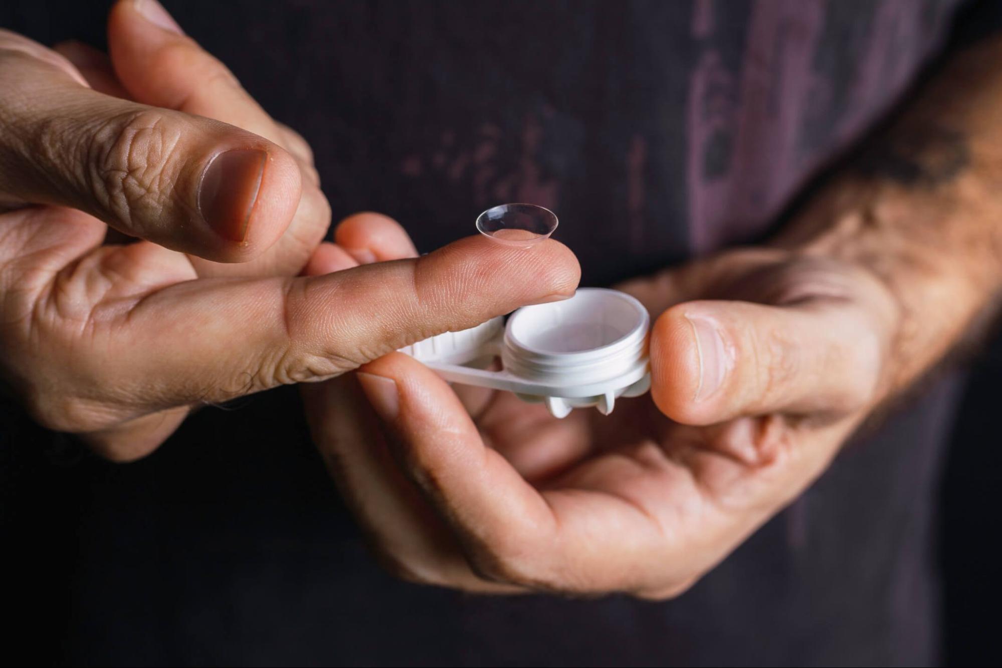 Removing a contact lens from a clean storage case as part of safe colored contact lens care