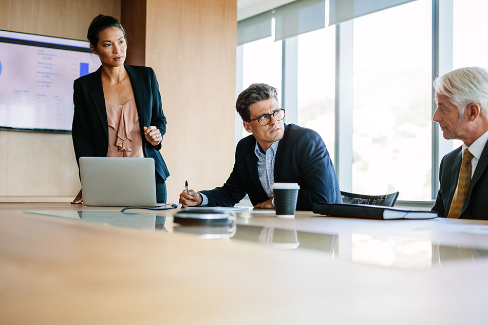 Confident female giving business presentation