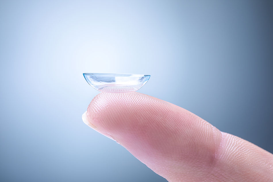 contact lens on tip of finger