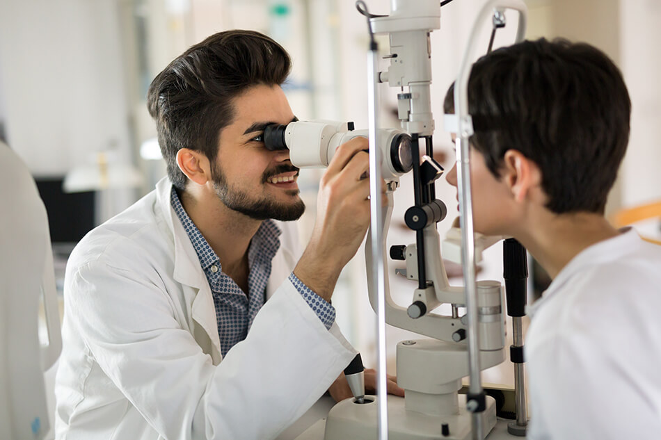 eye doctor examining patient’s vision