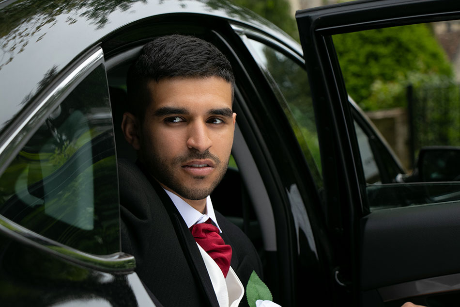 groom getting out of car