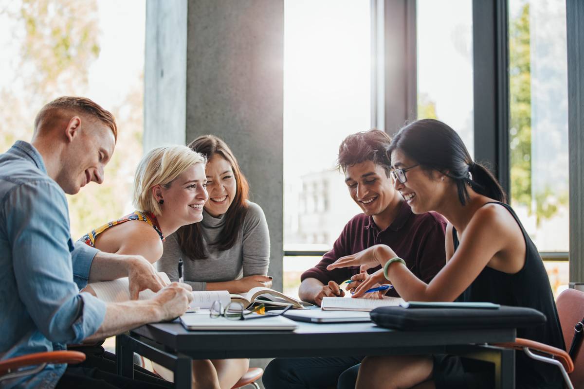 group of friends studying happily