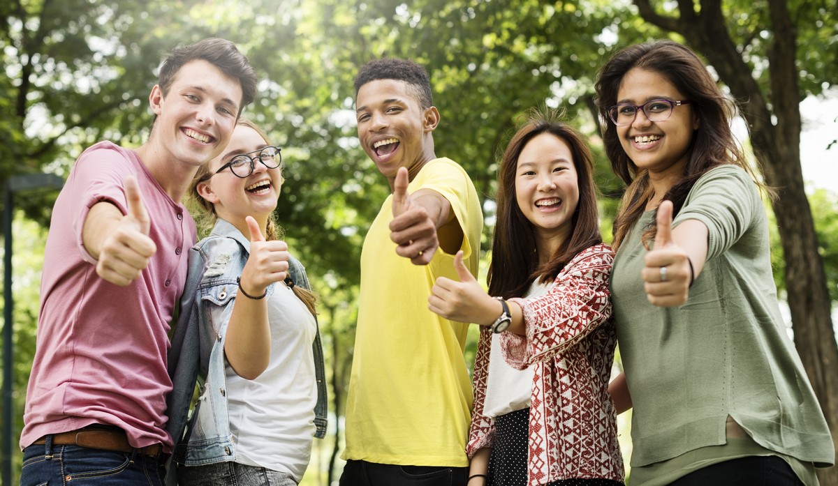 group of young people giving thumbs up