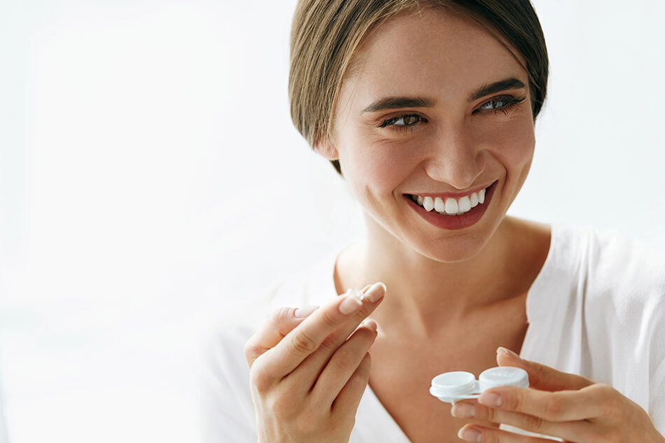 happy woman with contact lens