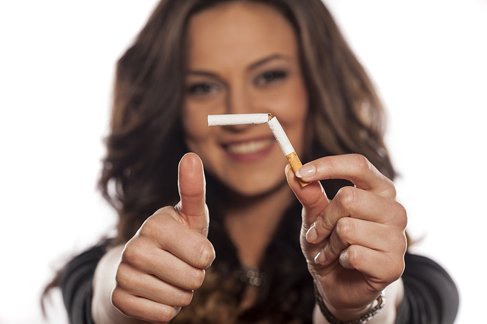 Happy young woman who quit smoking