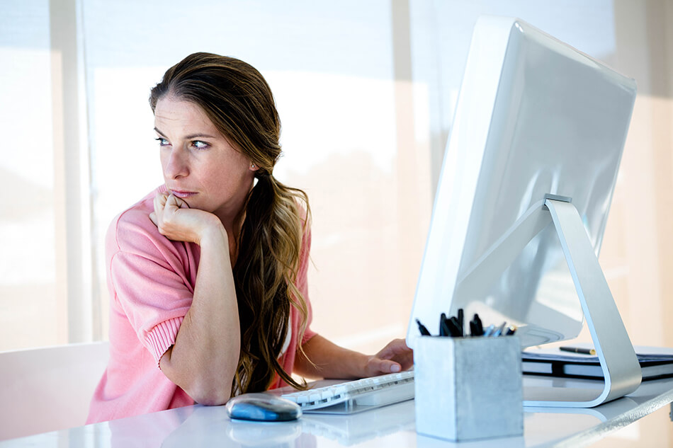 woman demonstrating good eye protection by looking away from her computer screen