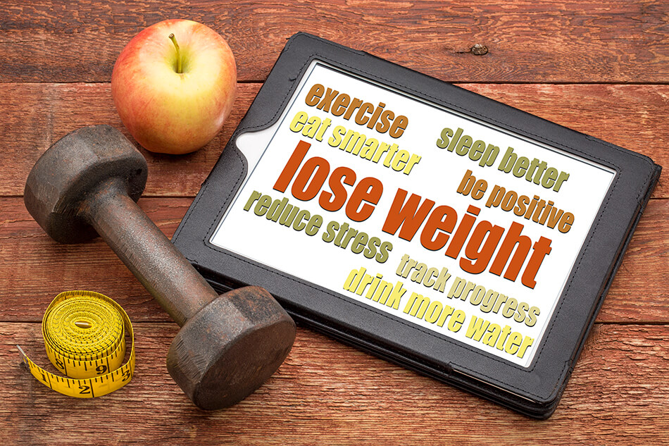 Dumbbell, tape measure, apple and sign for losing weight