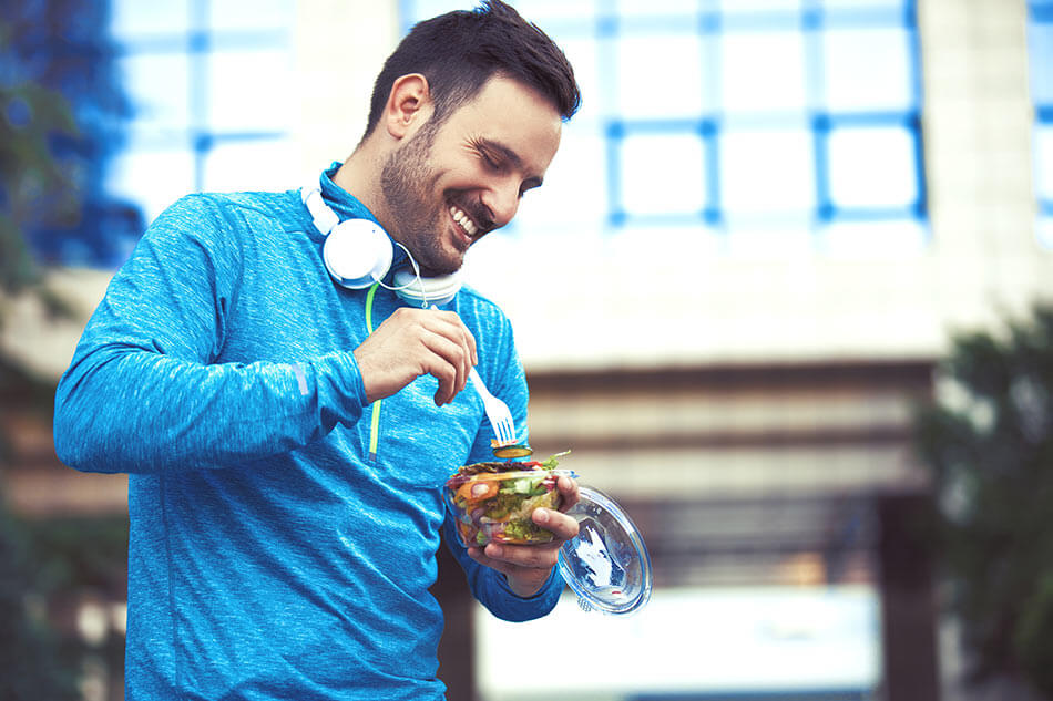 Man eating salad for eyesight improvement