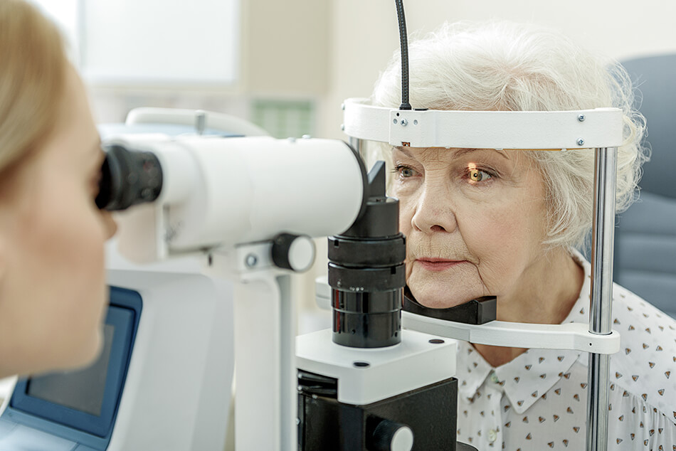 older woman having an eye exam