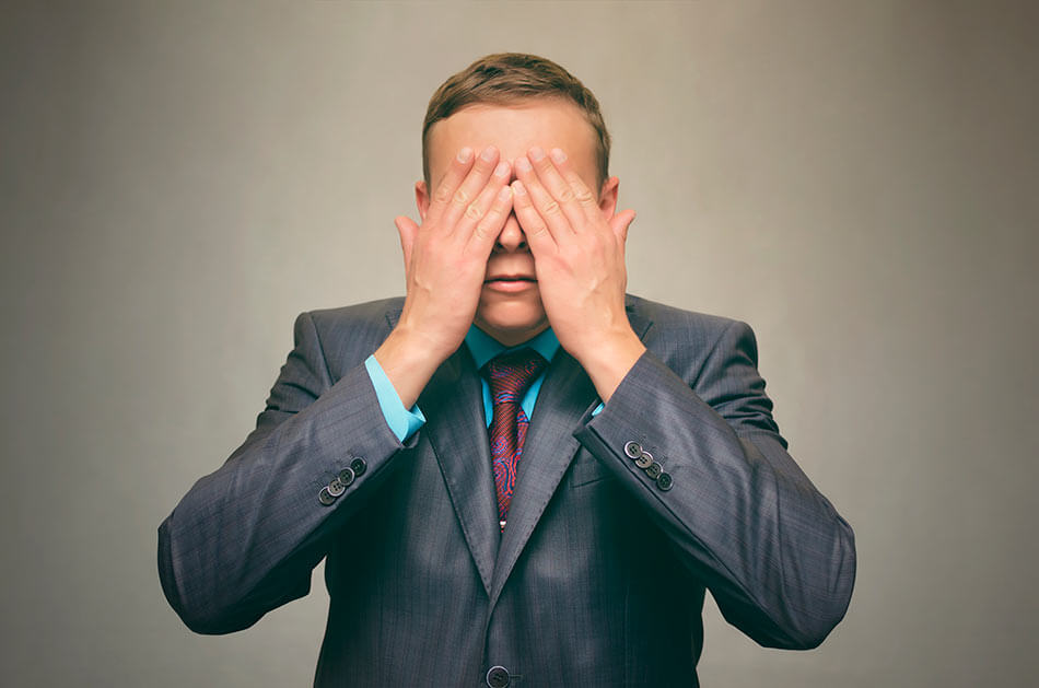 man practicing palming exercise