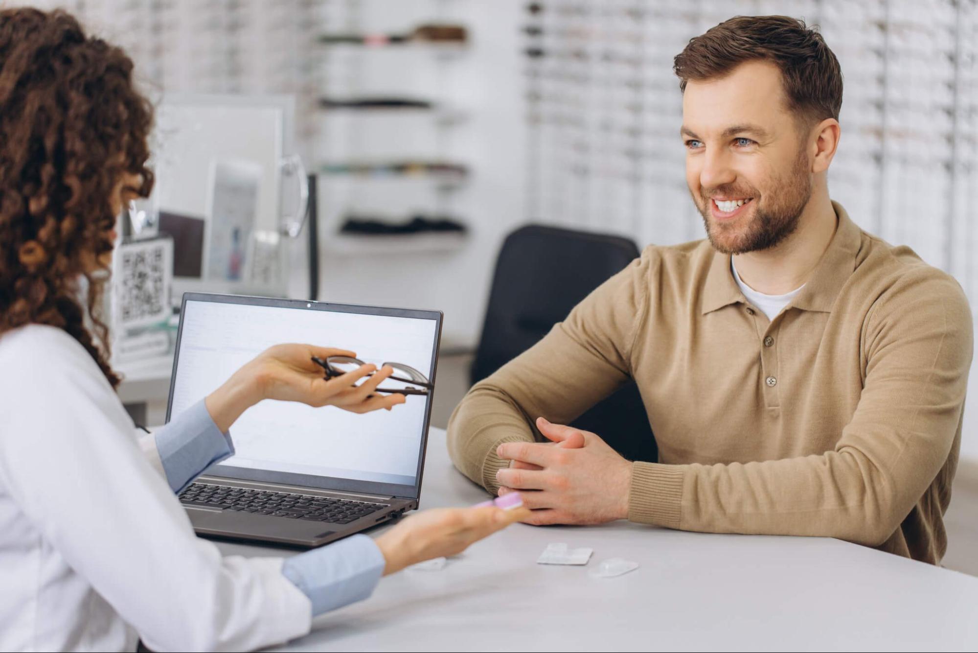 Patient consulting with an optometrist about multifocal contact lenses
