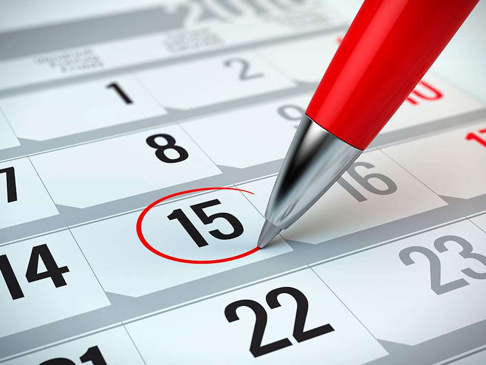 Crayon encerclant une date en rouge sur un calendrier