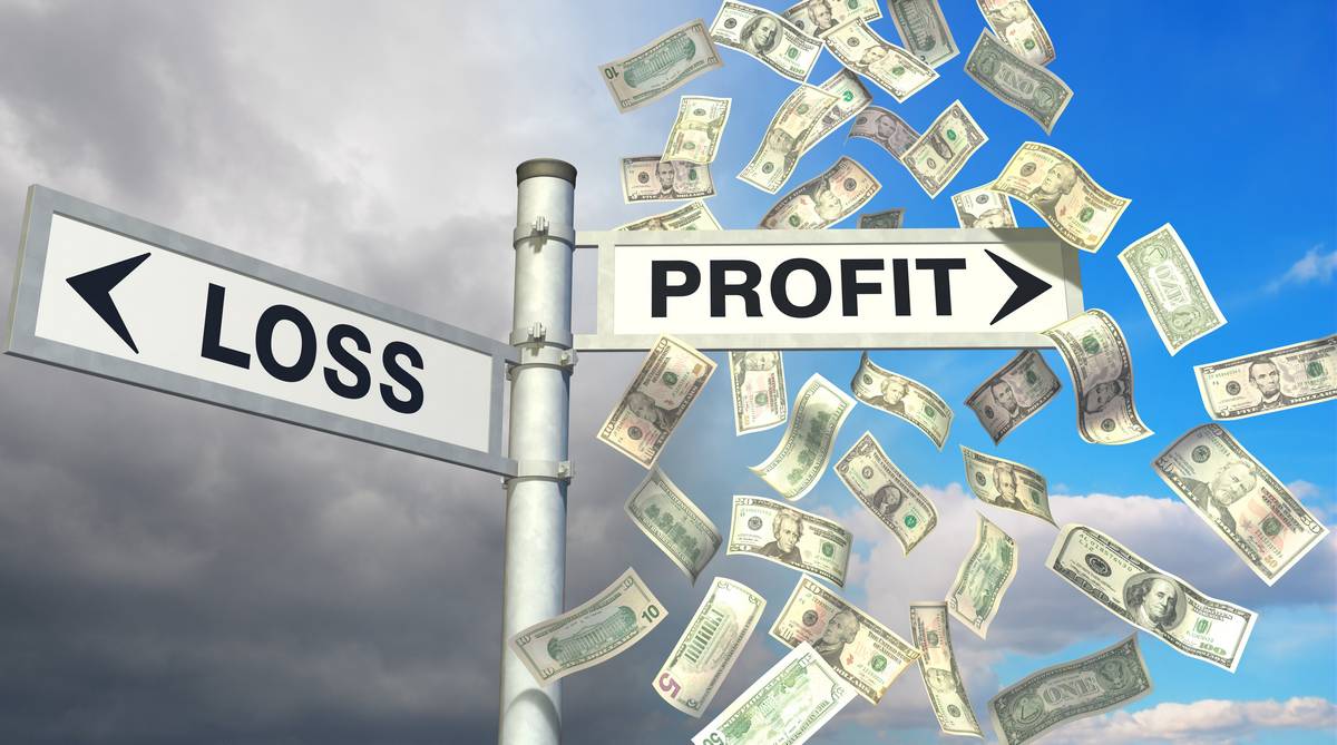 profit and loss sign post with dollar bills on the profit side