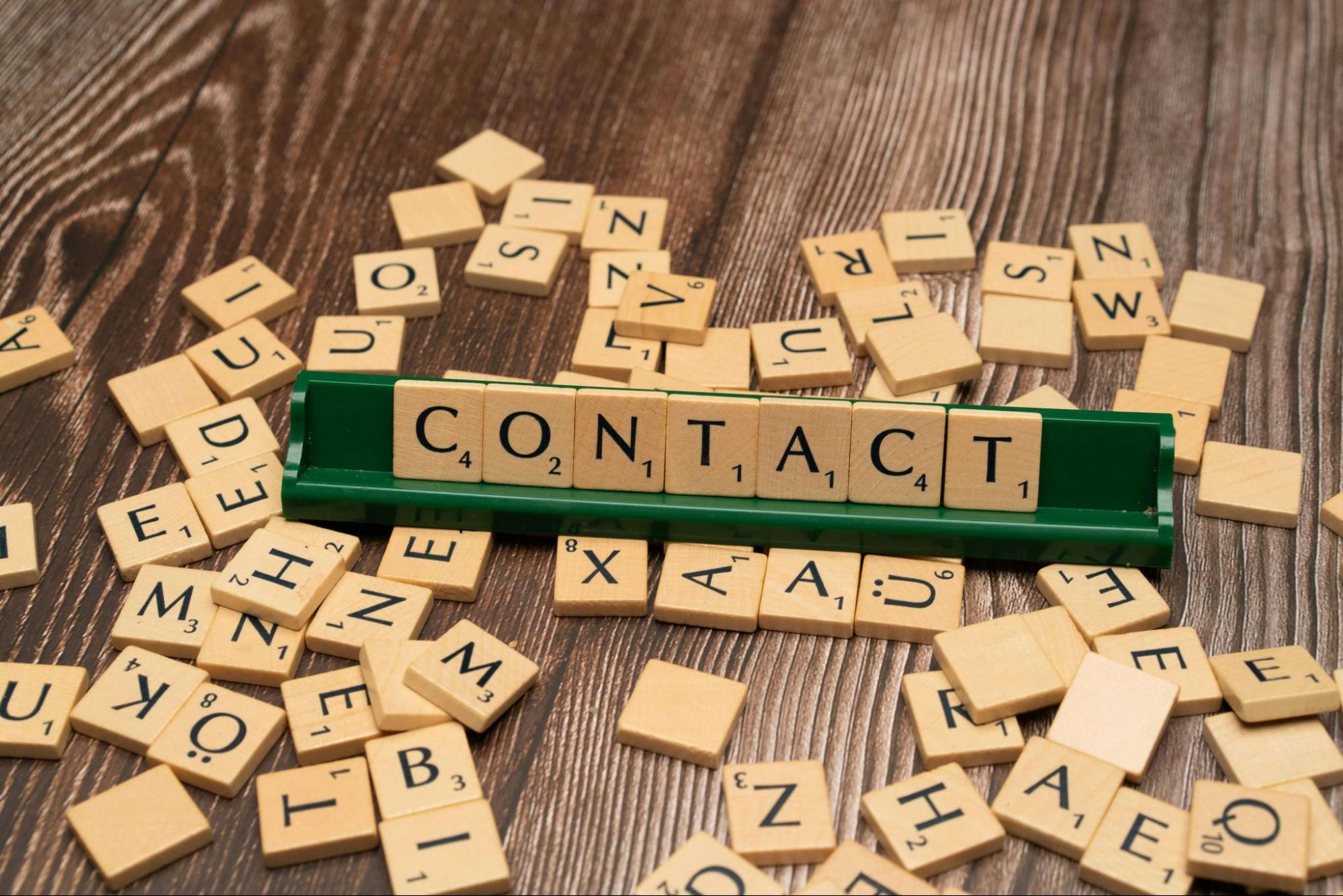Scrabble tiles spelling contact representing contact lenses eligible for FSA and HSA spending