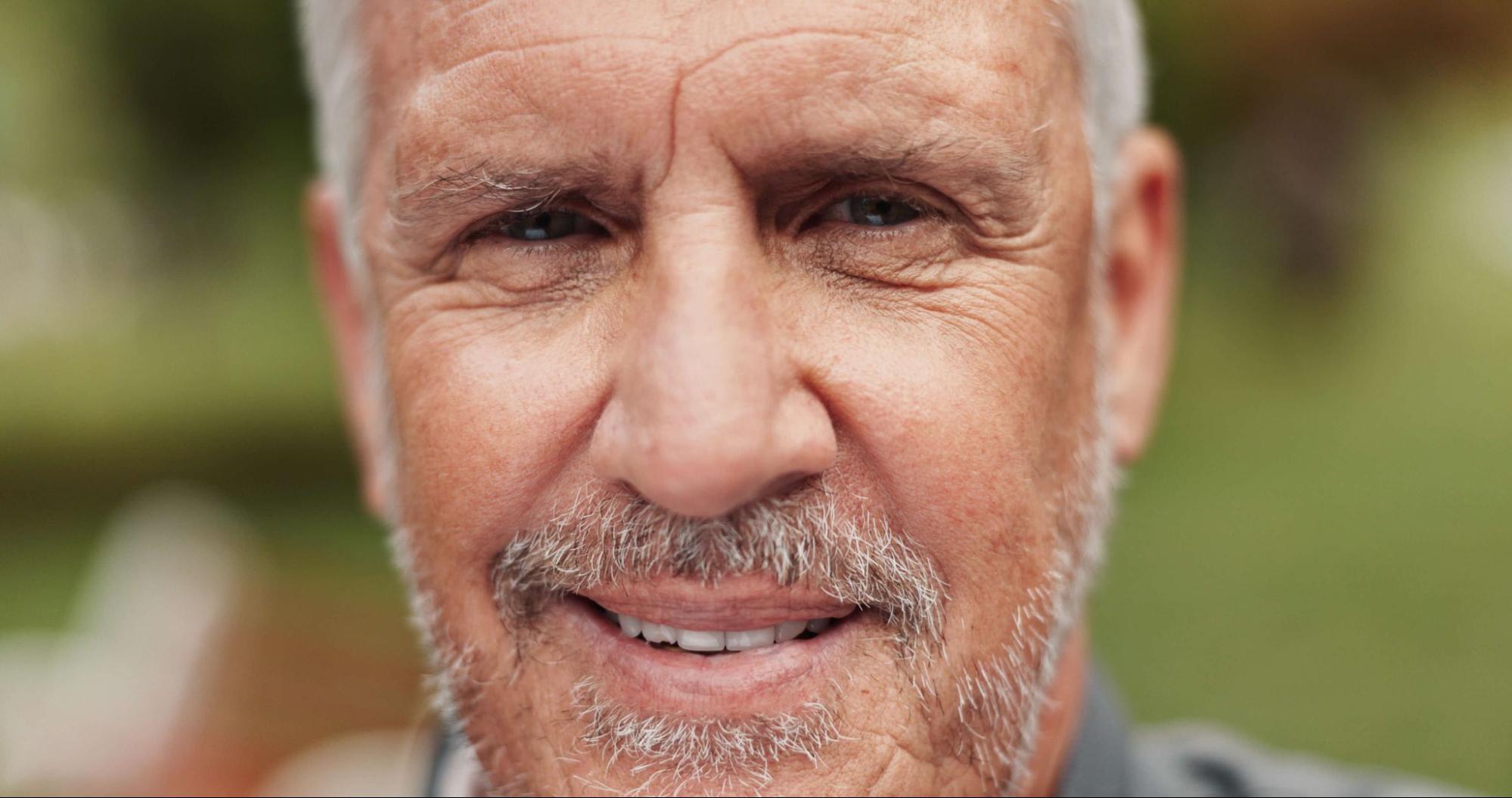 Smiling man over 40 enjoying the freedom of clear vision with multifocal contacts