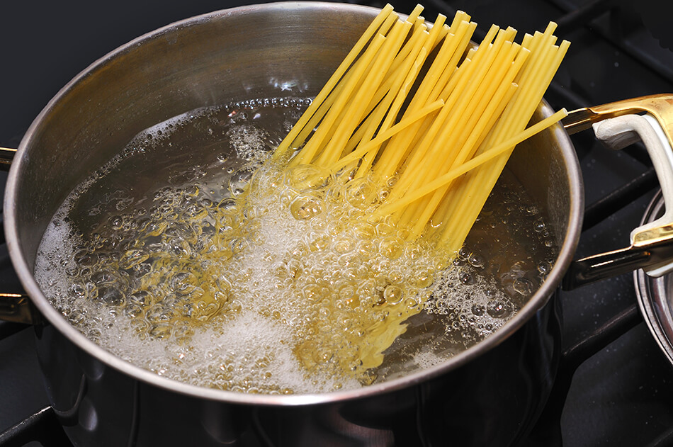 spaghetti boiling in a pot