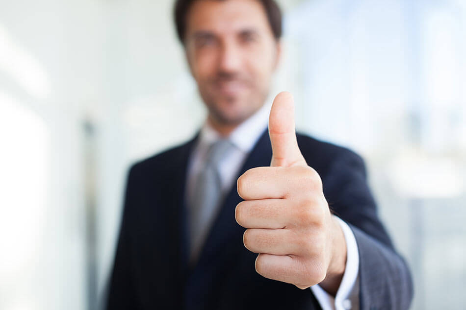 man focusing on his thumb during change of focus exercise