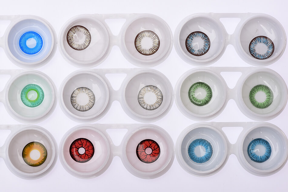 a tray of many contact lenses in different colors