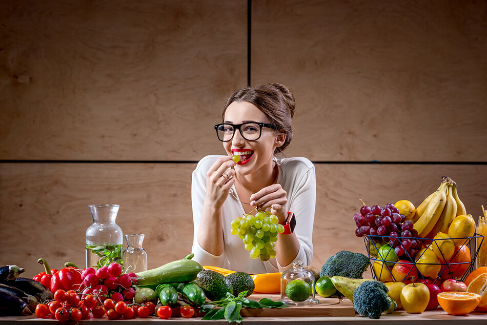 woman eating healthy diet and wearing eyeglasses