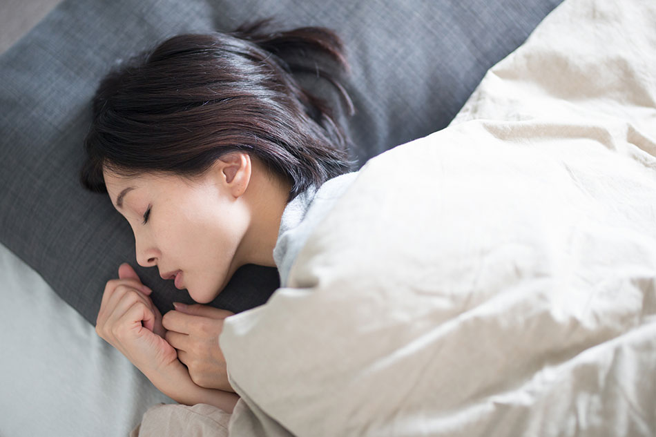 woman sleeping on side