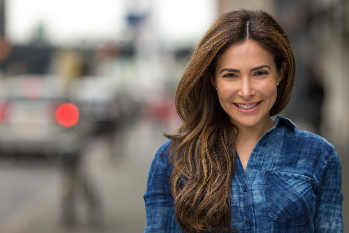 woman smiling with blurred background