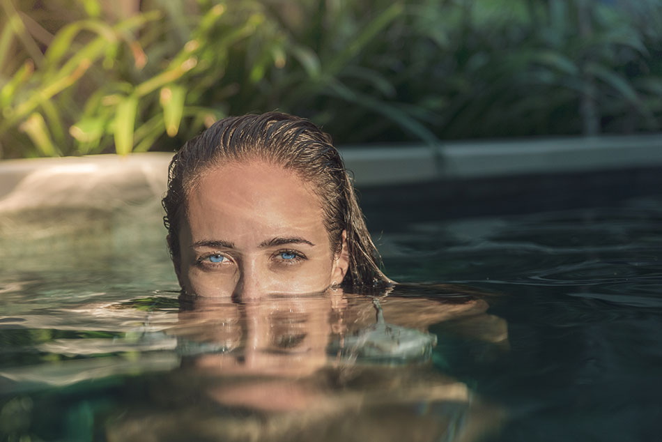 woman in swimming pool with contacts