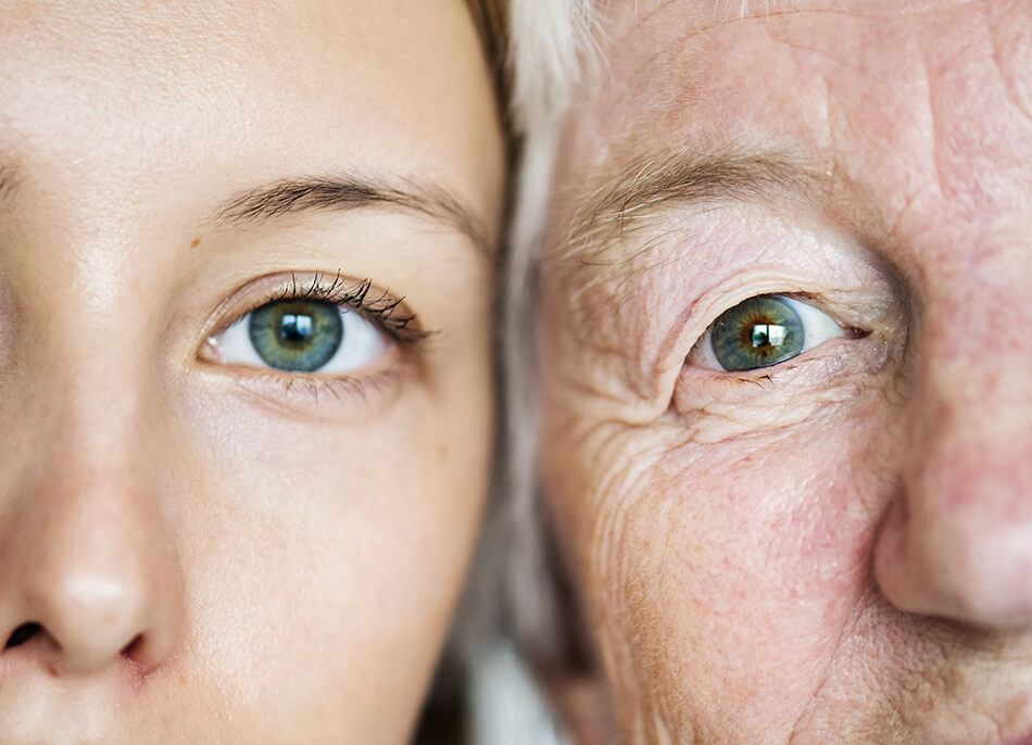 a close up of the side-by-side faces of a young woman and an older gentleman