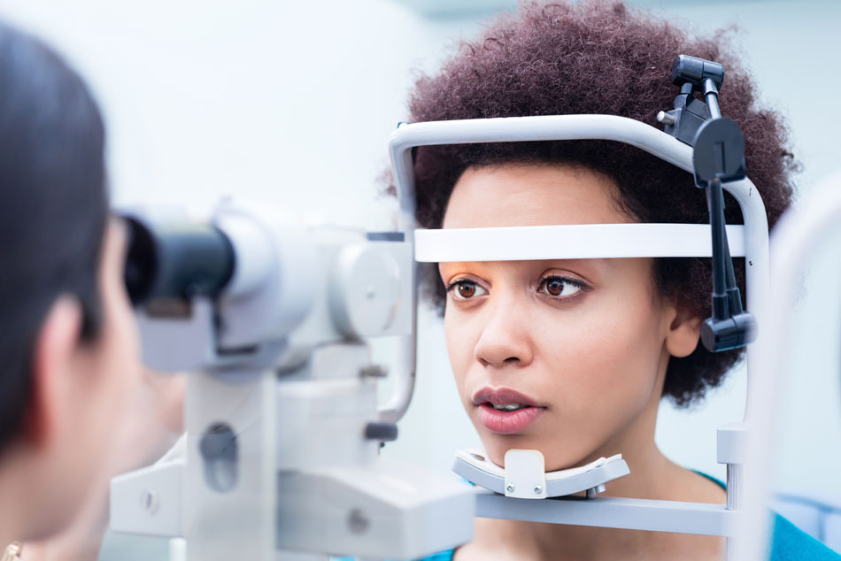 Young woman in contact lens exam