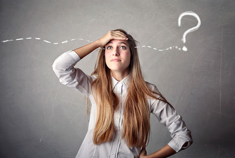 Young woman wearing contacts trying to remember when she needs to change them